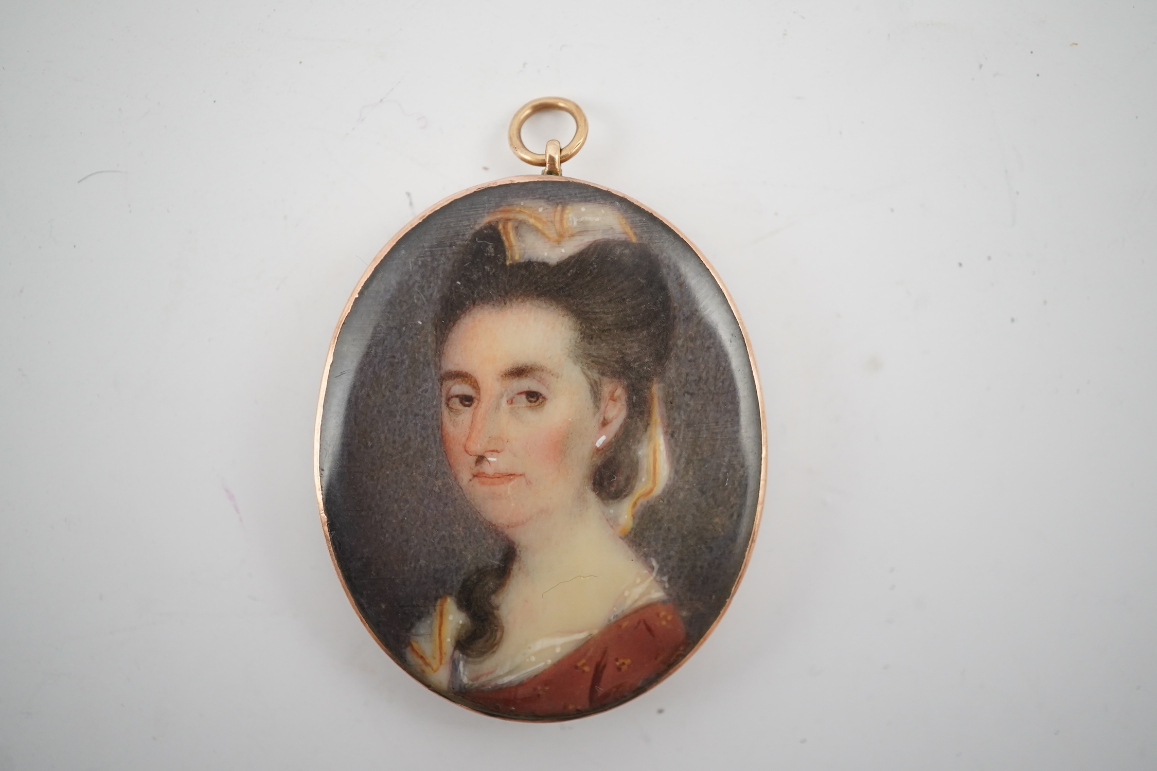 An early 19th century portrait miniature of a lady with Miers style silhouette of a gentleman verso, gold framed, 4.5cm high overall. CITES Submission reference HYCB3BFA. Condition - fair to good